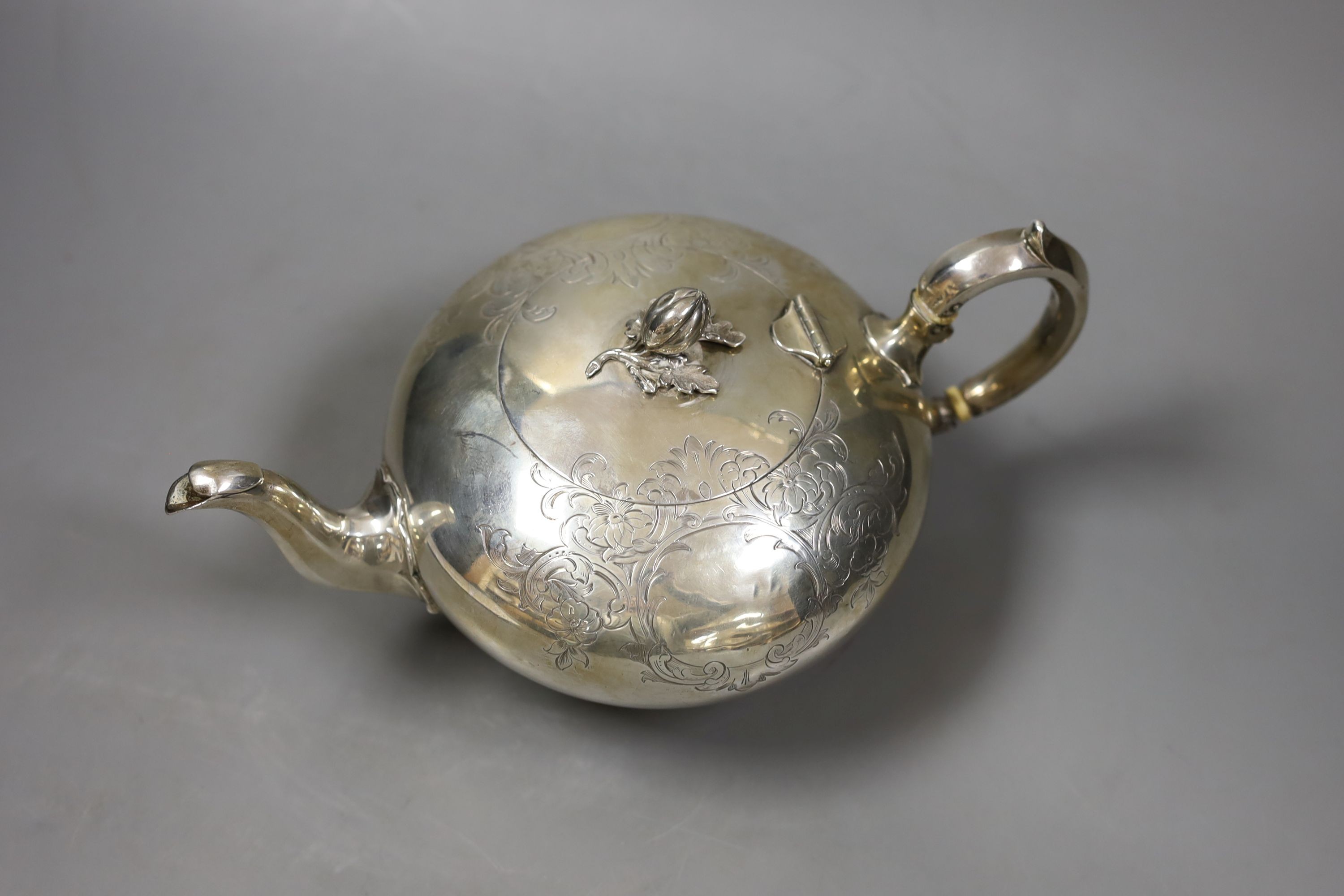 A Victorian engraved silver teapot by William Robert Smily, London, 1952